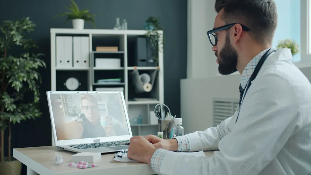 Physician on a video consultation at his desk