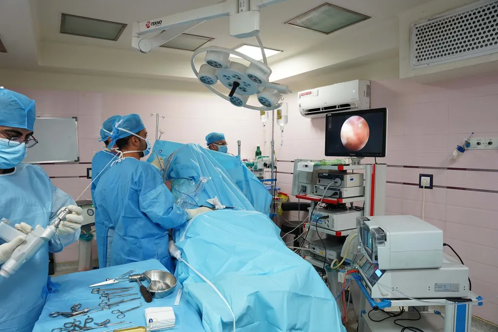 Clinical team performing an endoscopic procedure with the image on a monitor