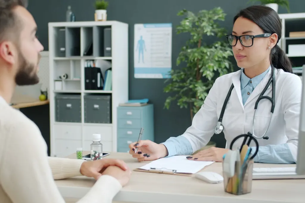 Physician talking with a patient in a clinic office