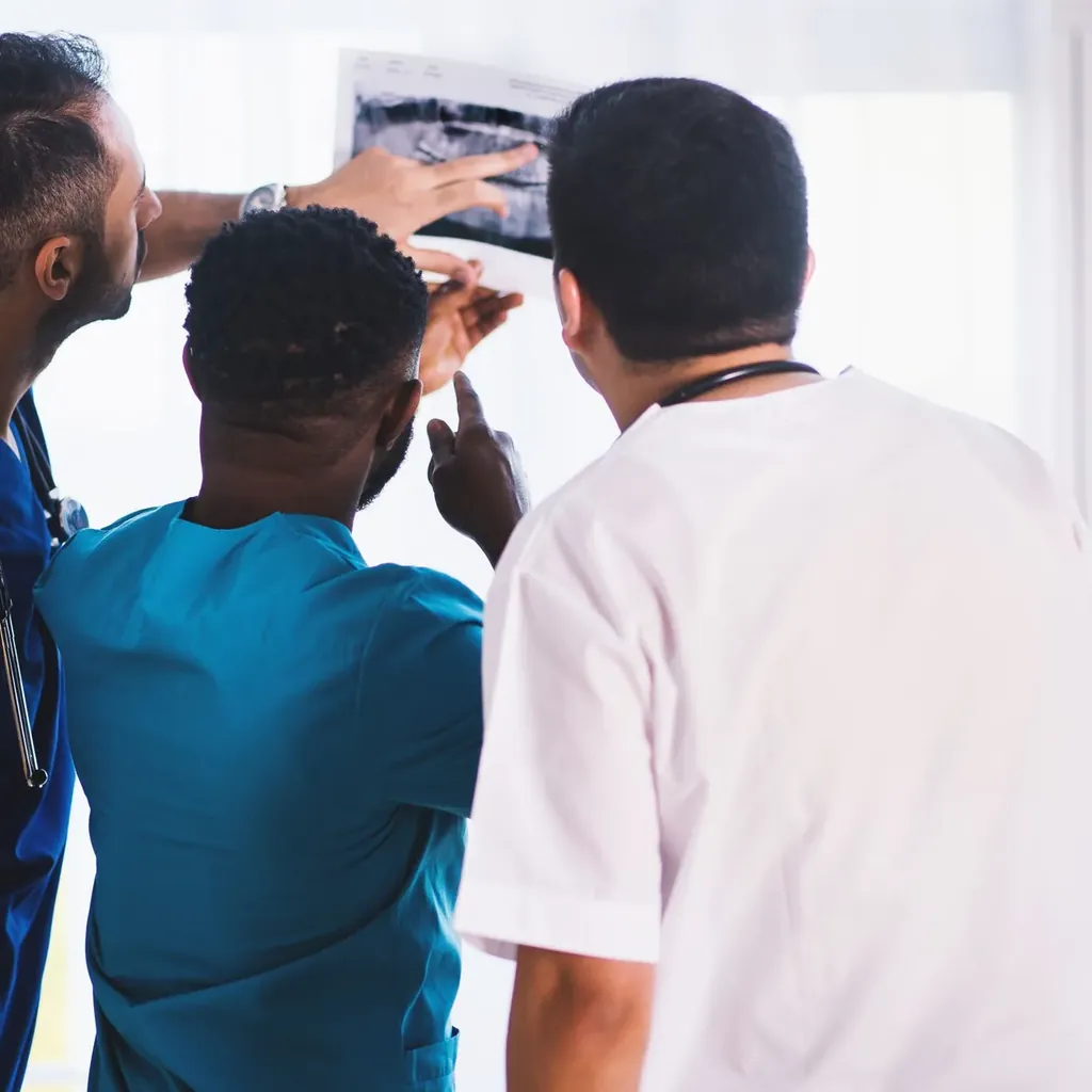 Clinicians looking at an X-ray together