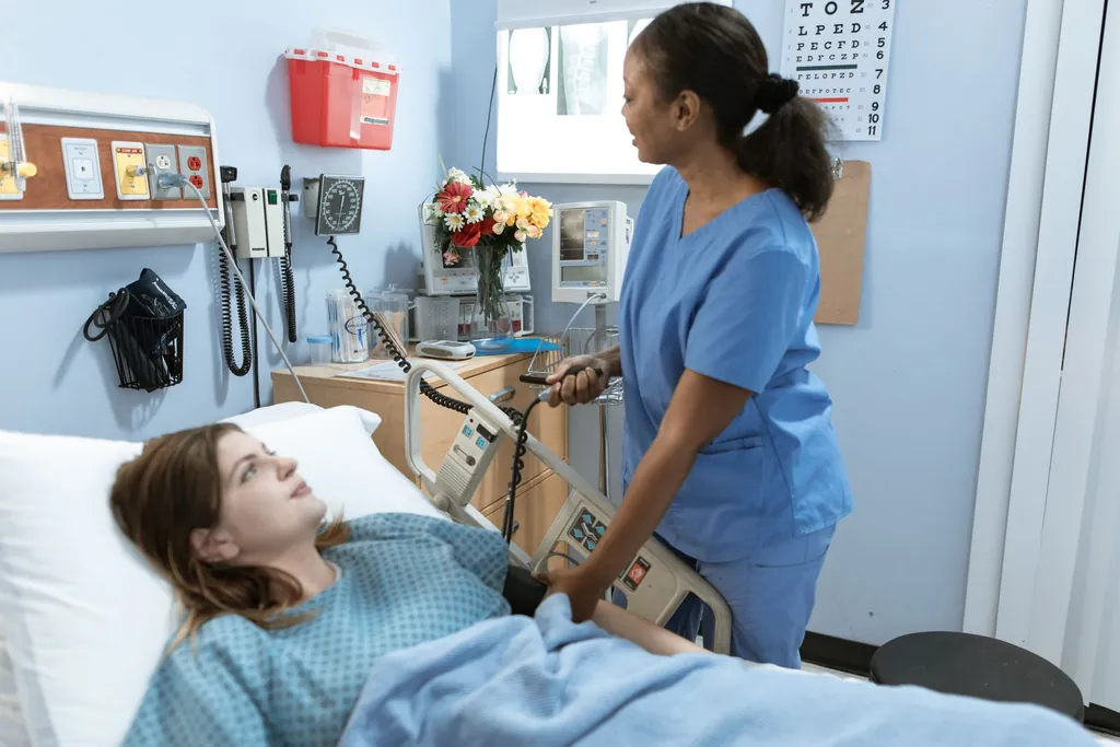 Nurse measuring a patient's blood pressure at a hospital bedside