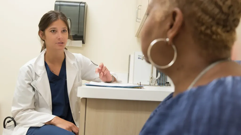 Doctor talking with a patient in an exam room